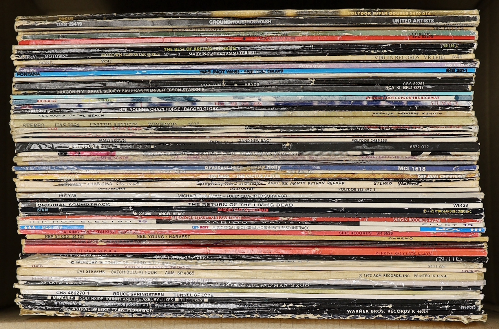 Seventy mostly 1970's/80's LPs, including Focus, Steve Forbert, Aretha Franklin, Dionne Warwick, Dire Straits, Simple Minds, Neil Young, Bruce Springsteen, etc.